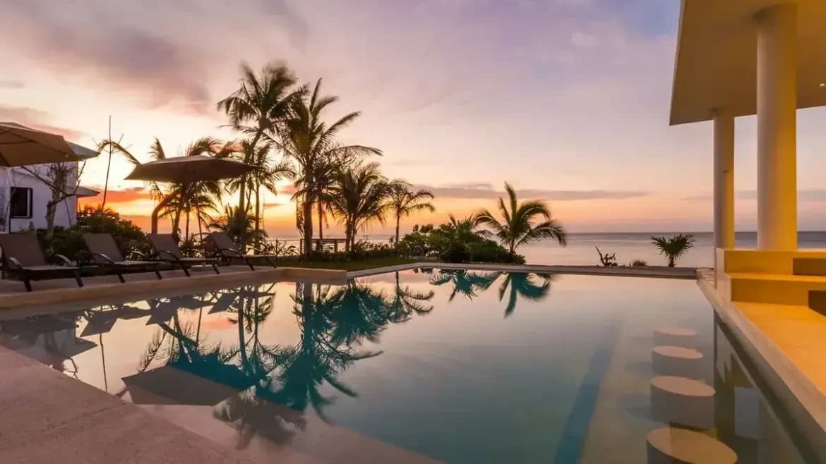 Infinity pool overlooking the Caribbean at sunset